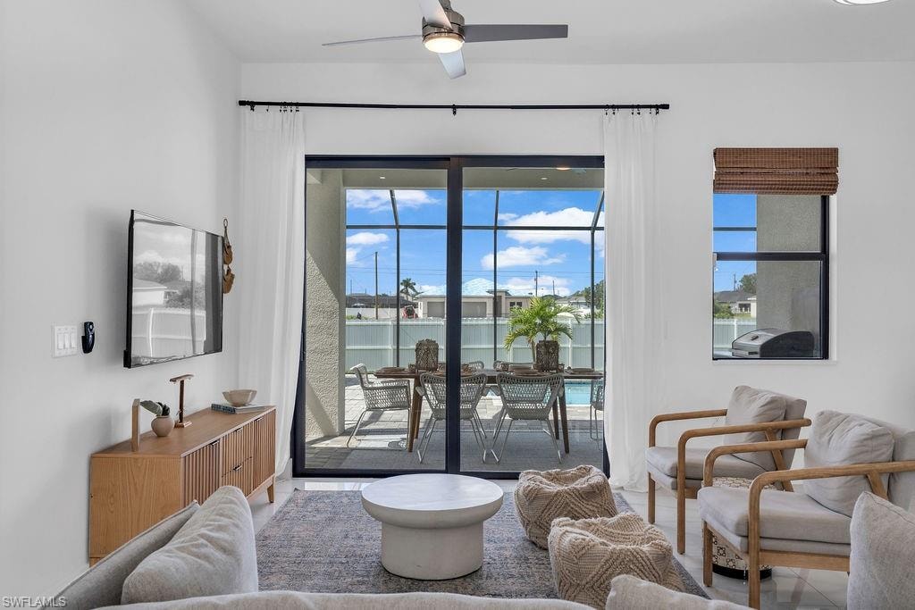 Living area featuring ceiling fan
