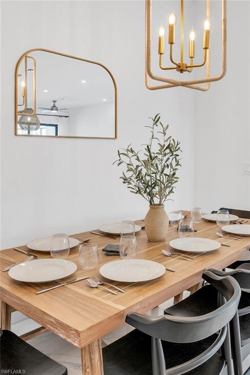 Dining area with a chandelier