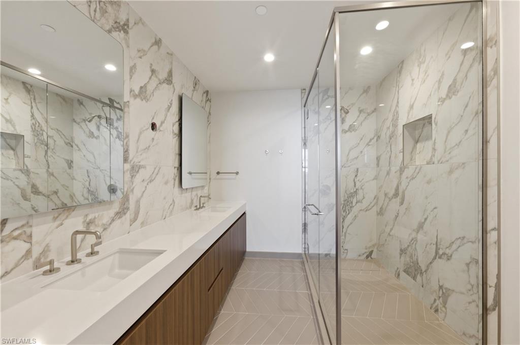 Oversize dual sinks & spacious walk-in shower.