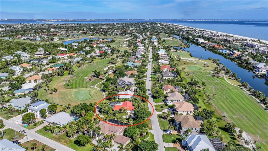 View of property location with a large body of water and nearby suburban area