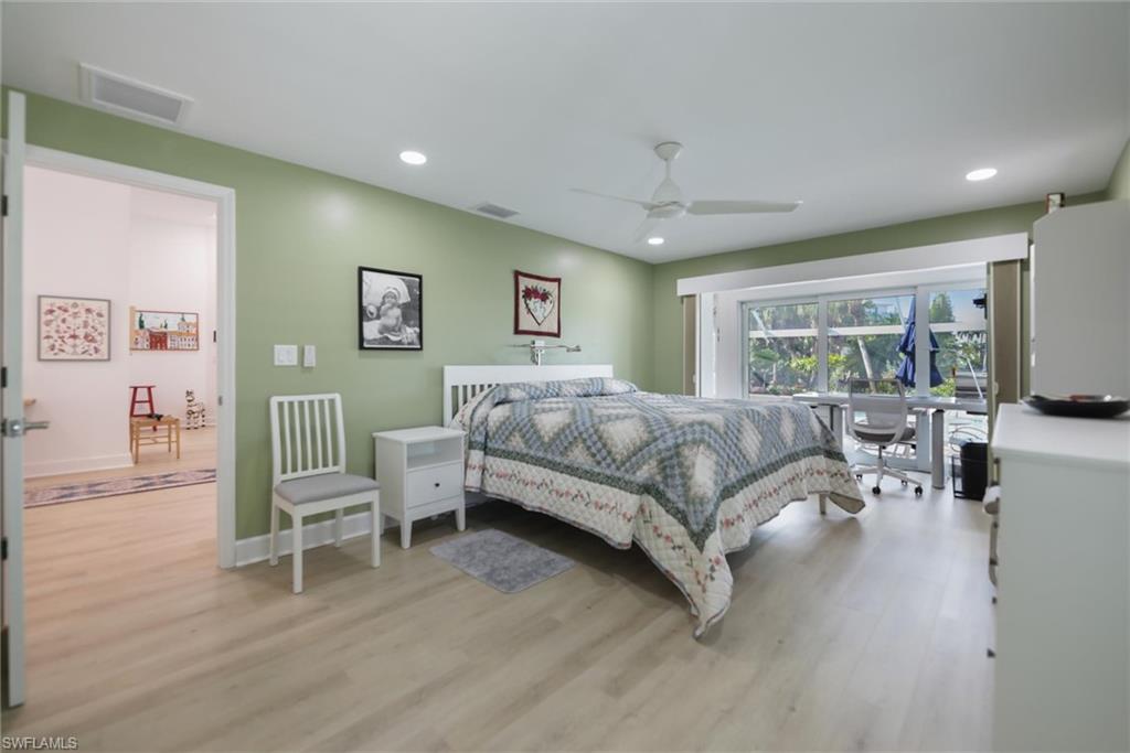 Bedroom featuring light wood-style flooring, recessed lighting, and ceiling fan