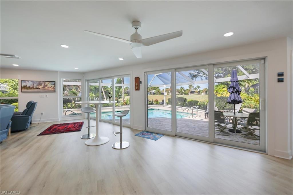 Dining space with plenty of natural light, light wood finished floors, recessed lighting, and ceiling fan
