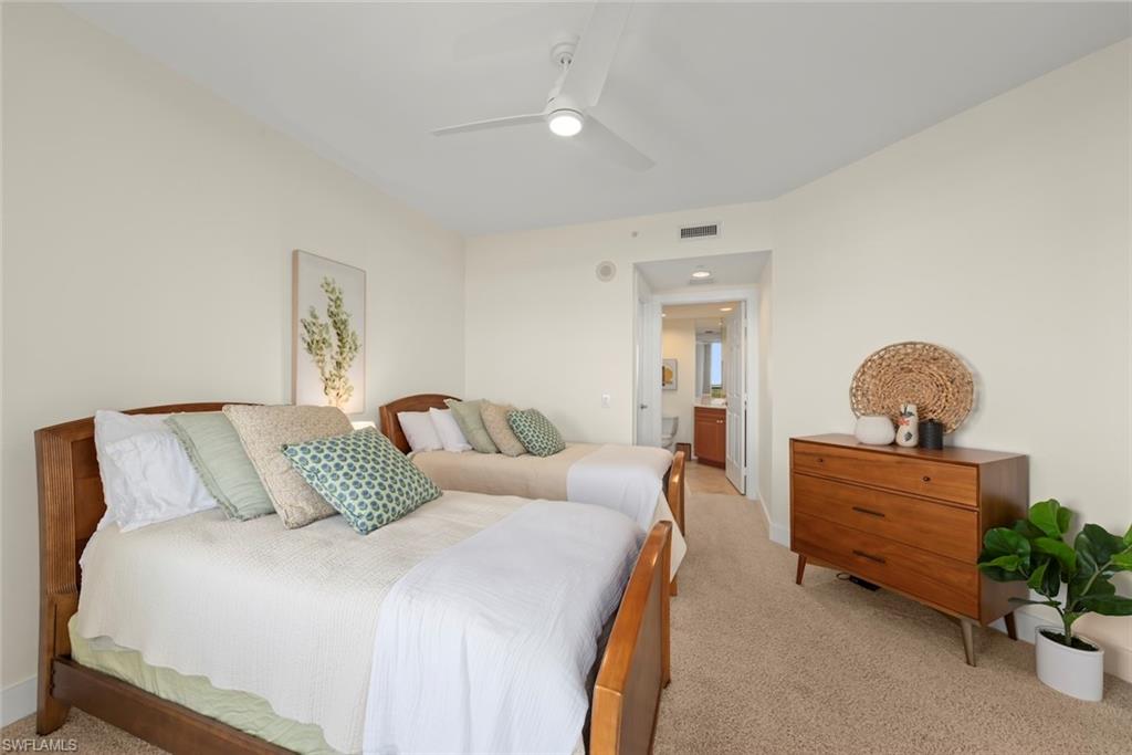 Bedroom with light carpet and ceiling fan