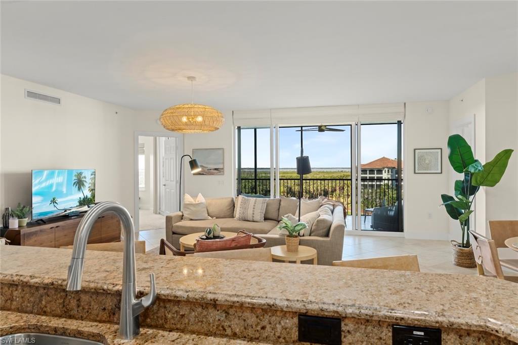 Living room with light tile patterned floors