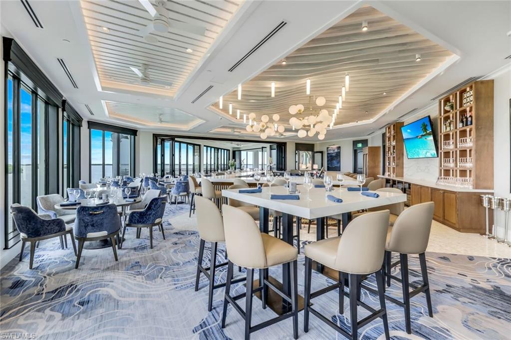 Dining area featuring plenty of natural light and a raised ceiling