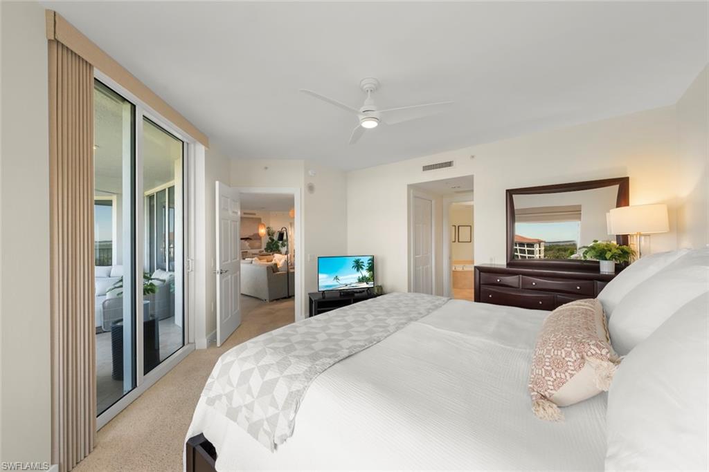 Bedroom featuring light carpet, access to outside, and ceiling fan