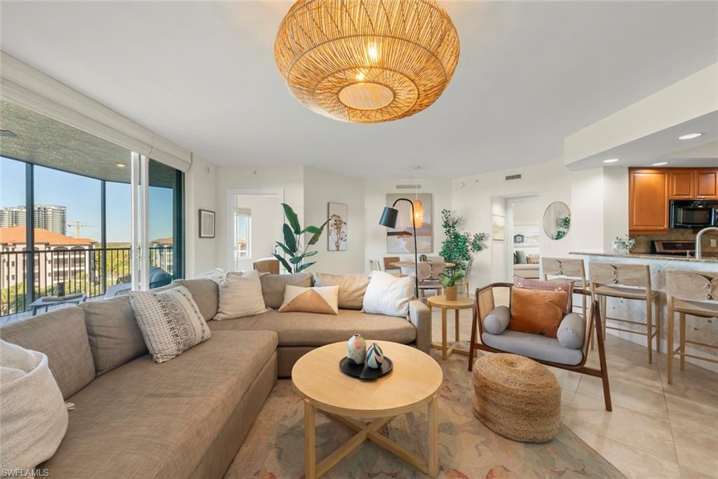 Living room with recessed lighting and light tile patterned floors