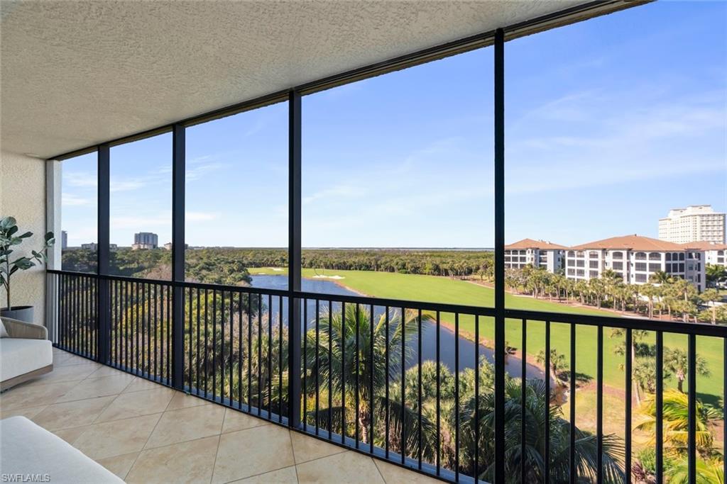 Unfurnished sunroom with a water view