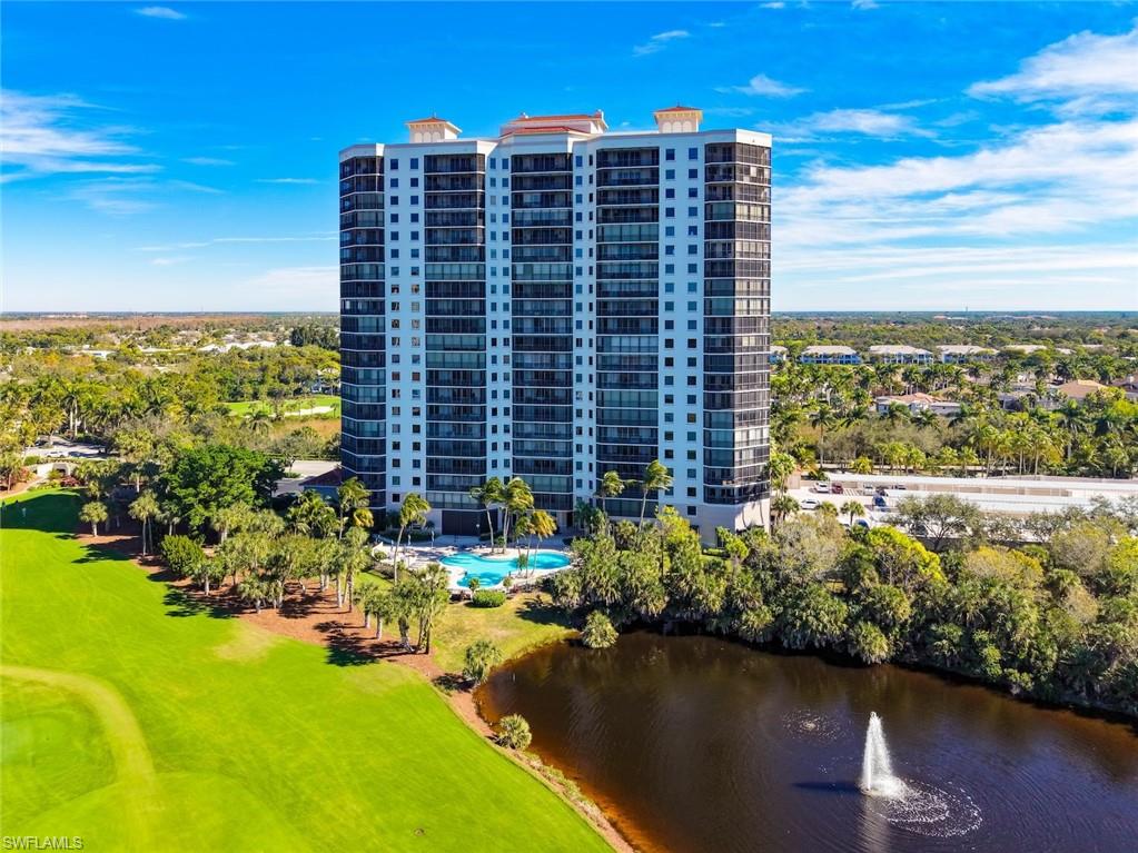 Aerial view of apartment complex and a large body of water