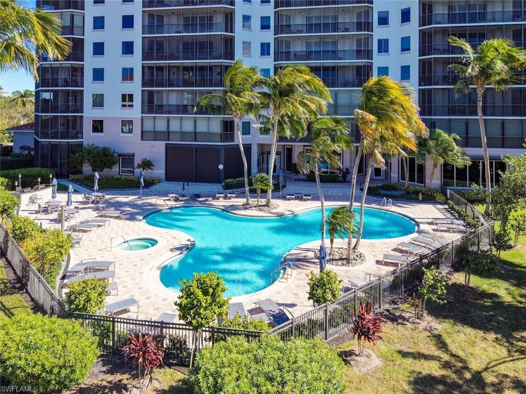 Community pool with a patio