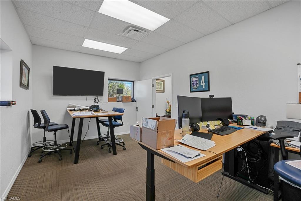 Office area featuring a paneled ceiling