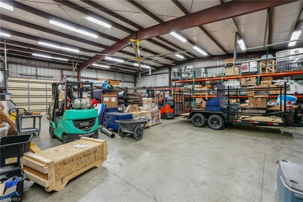 Garage with a workshop area and metal wall