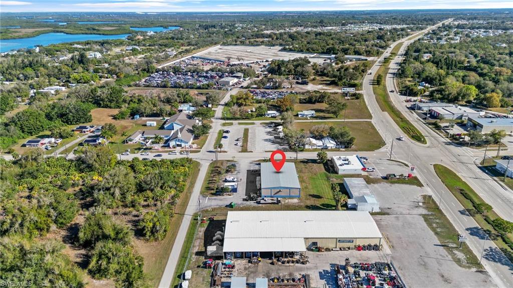 Aerial overview of property's location with a large body of water