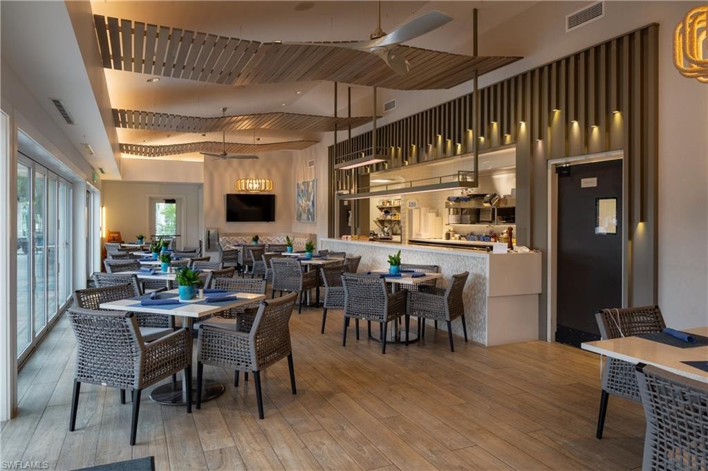 Dining area featuring a ceiling fan and hardwood / wood-style floors