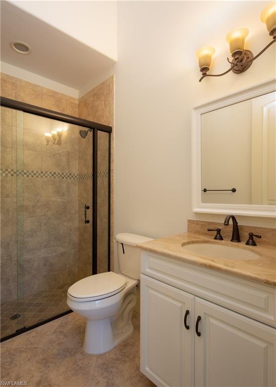 Bathroom with vanity and a stall shower