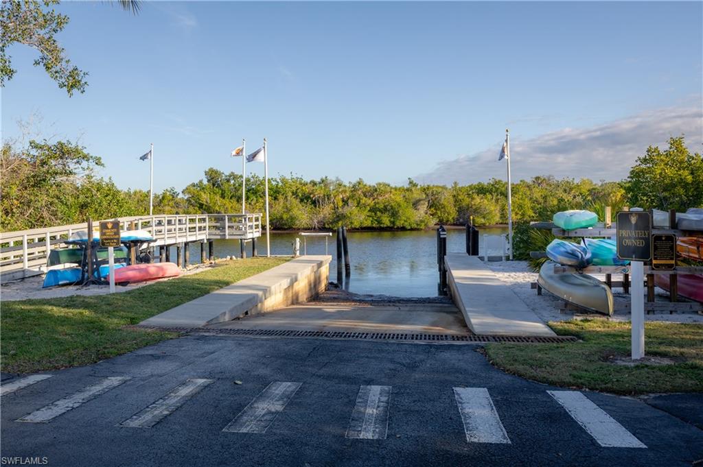 Dock featuring a boat ramp and a water view