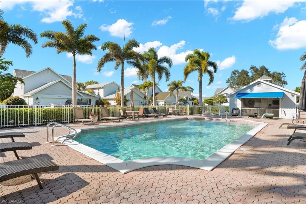 Community pool with a patio area