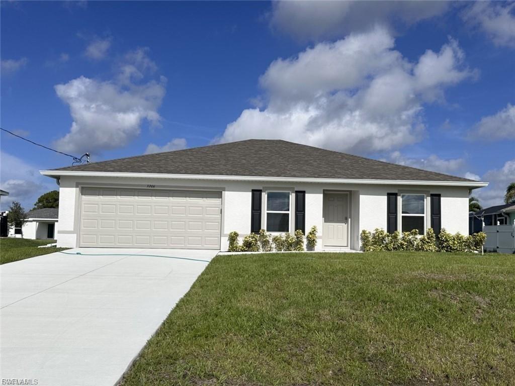 Single story home with stucco siding, a front yard, driveway, a garage, and a shingled roof