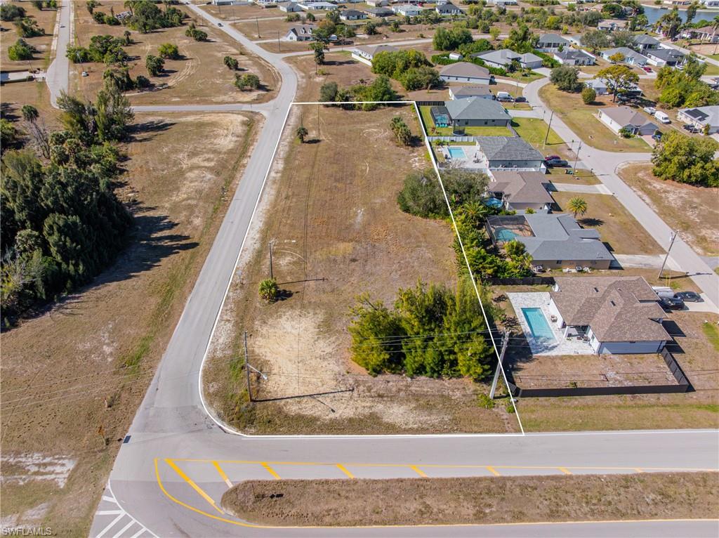 Aerial perspective of suburban area with property parcel outlined