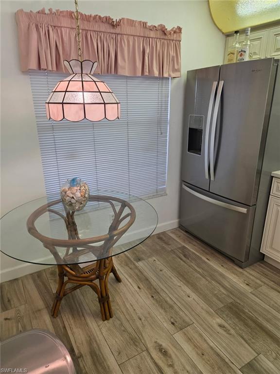 Dining room with light wood-style floors