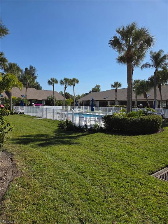 View of yard with a community pool