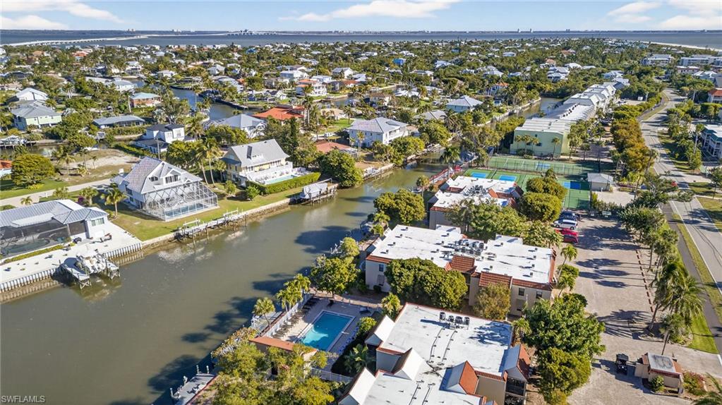 Aerial view of property's location featuring a large body of water