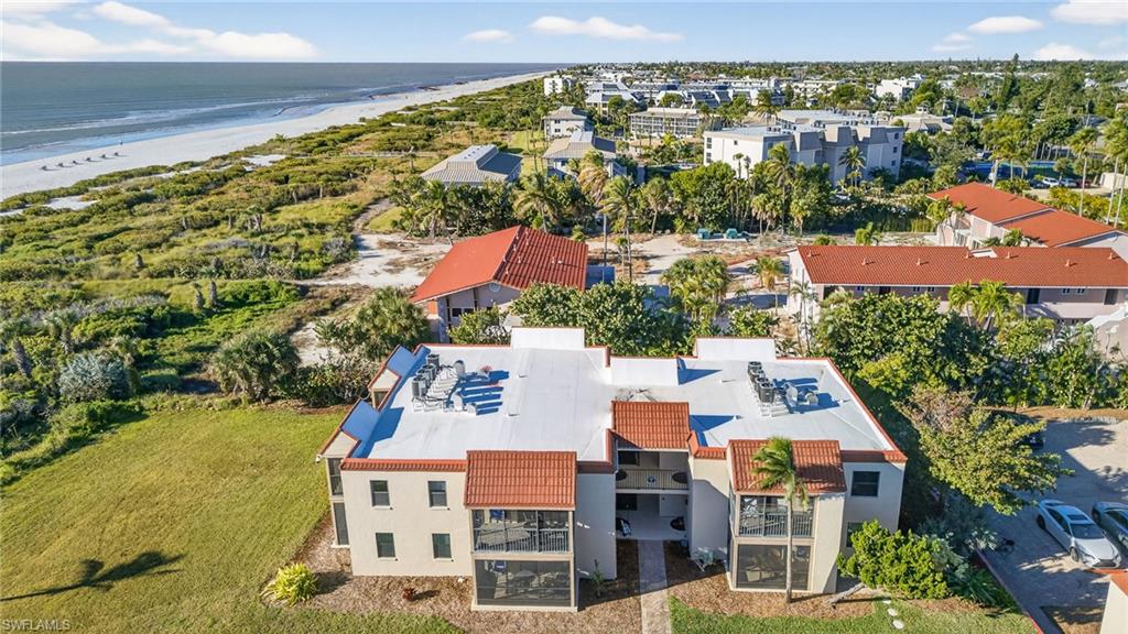 Drone / aerial view of waterfront with a beach