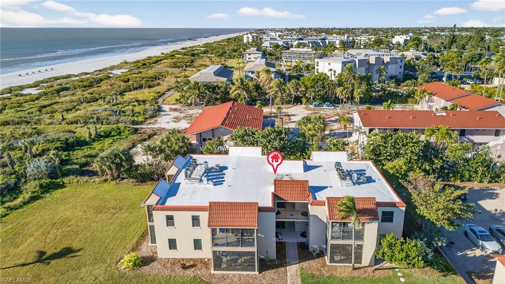 Aerial view of waterfront with a beach