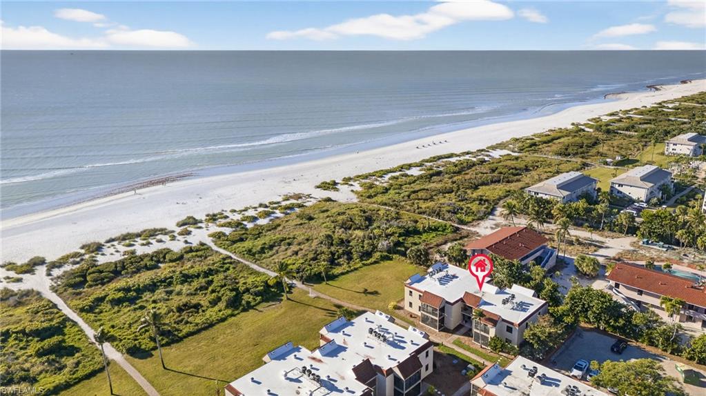 Aerial overview of property's location with expansive beach