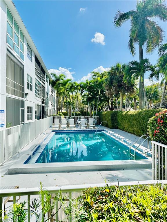 Community pool featuring a patio