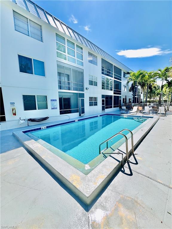 Community pool featuring a patio