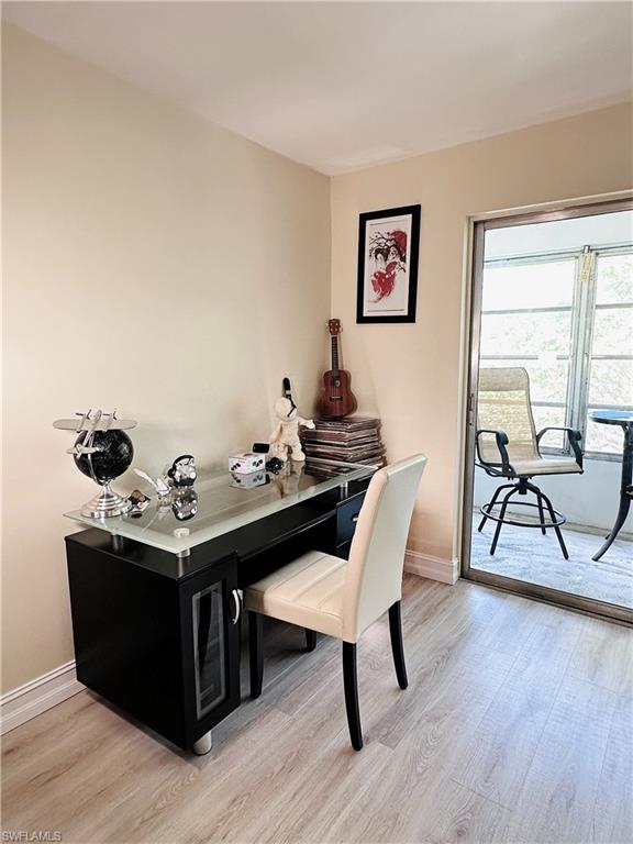 Office space featuring light wood-style flooring