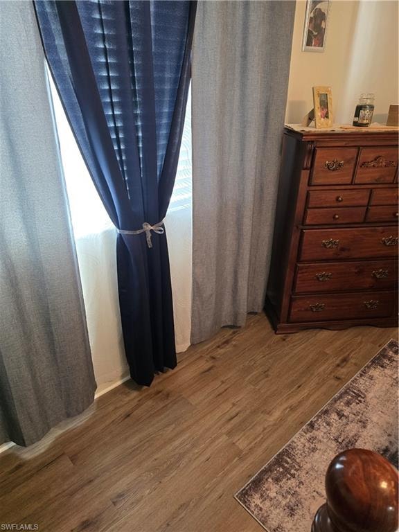 Bedroom featuring dark wood-style flooring