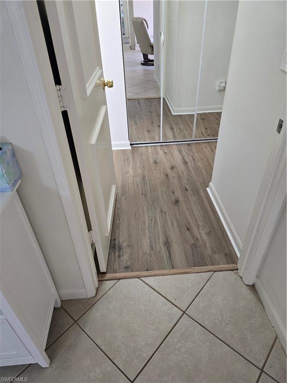 Hall featuring baseboards and light wood-style floors