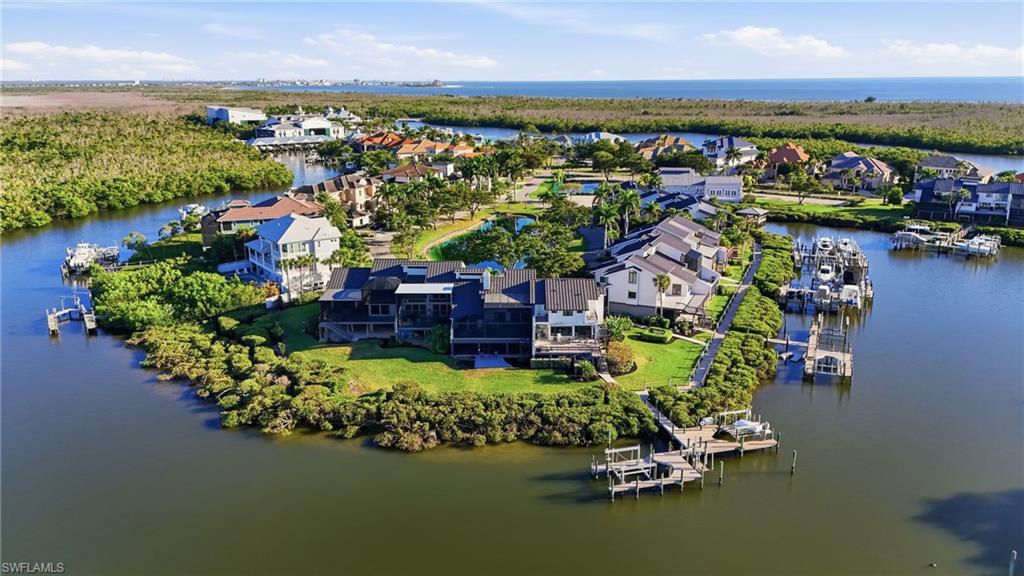 View of property location with a nearby body of water and nearby suburban area