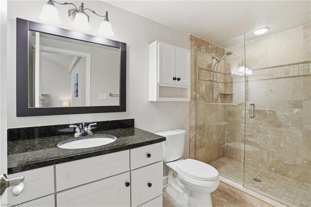 Full bath featuring vanity and a stall shower