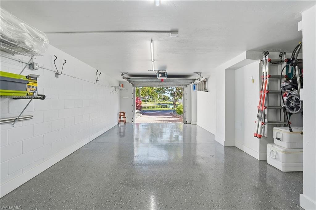 Garage featuring baseboards