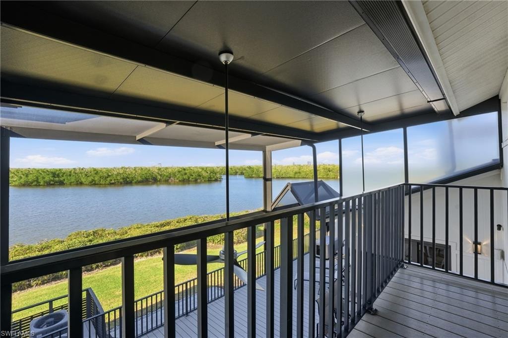 Unfurnished sunroom with a water view