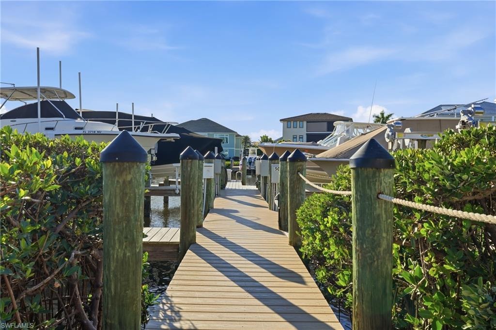 Dock area featuring a water view and boat lift