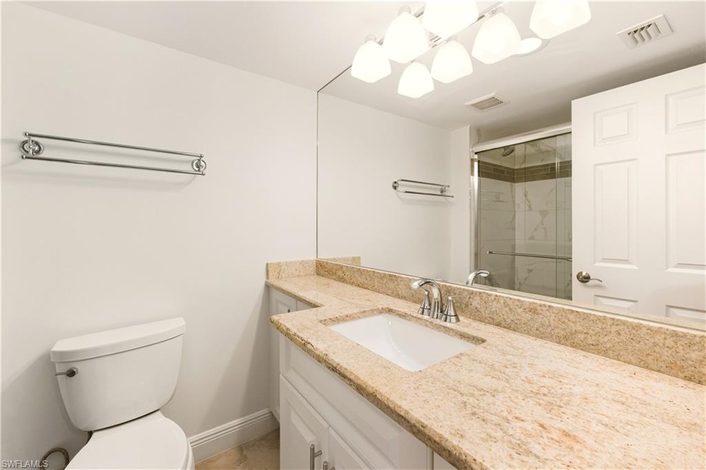 Full bathroom featuring a tile finish shower         and vanity