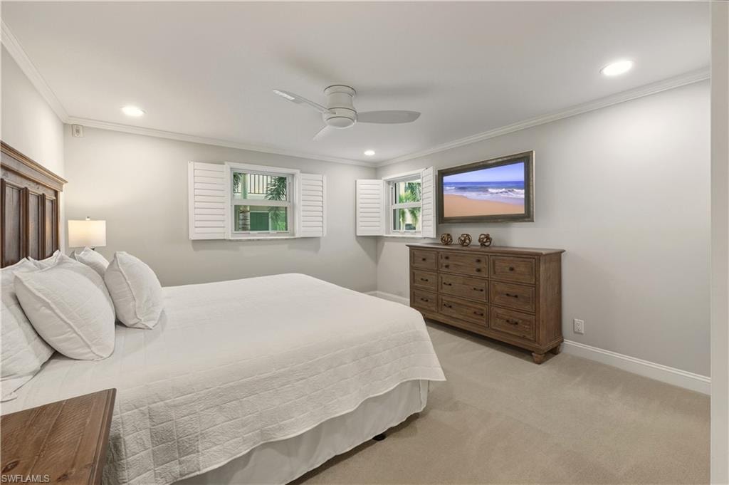 Bedroom featuring light carpet, ceiling fan, recessed lighting, and ornamental molding