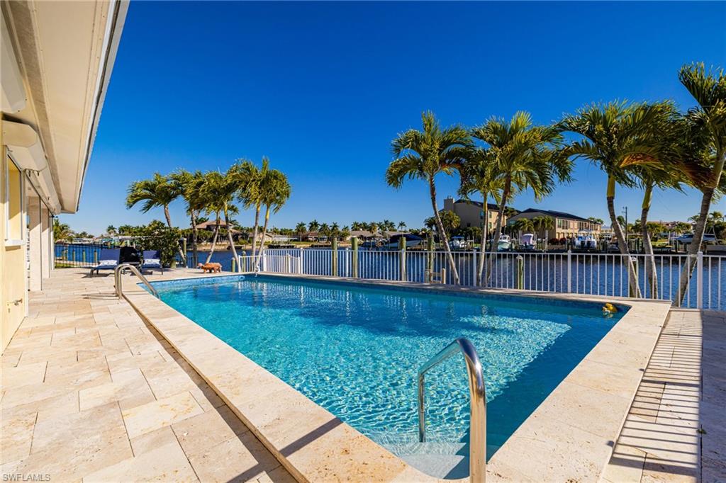 View of pool featuring a patio area and a residential view