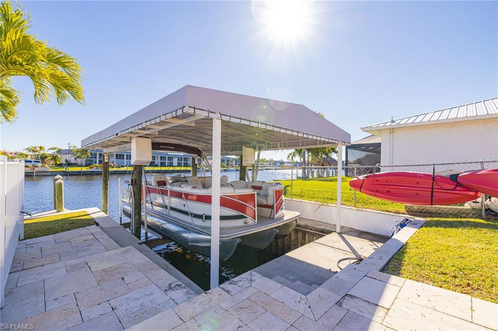 Dock with a water view and boat lift