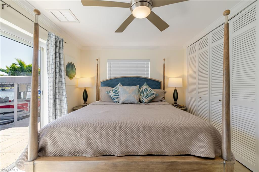 Bedroom with access to exterior, ornamental molding, a closet, and ceiling fan