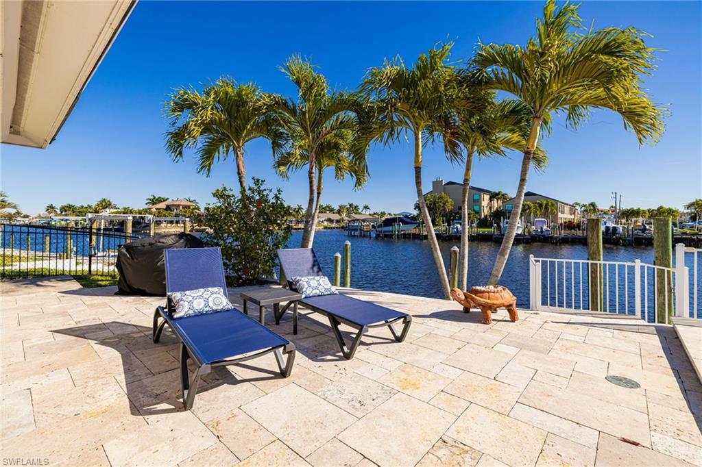 View of patio with a water view