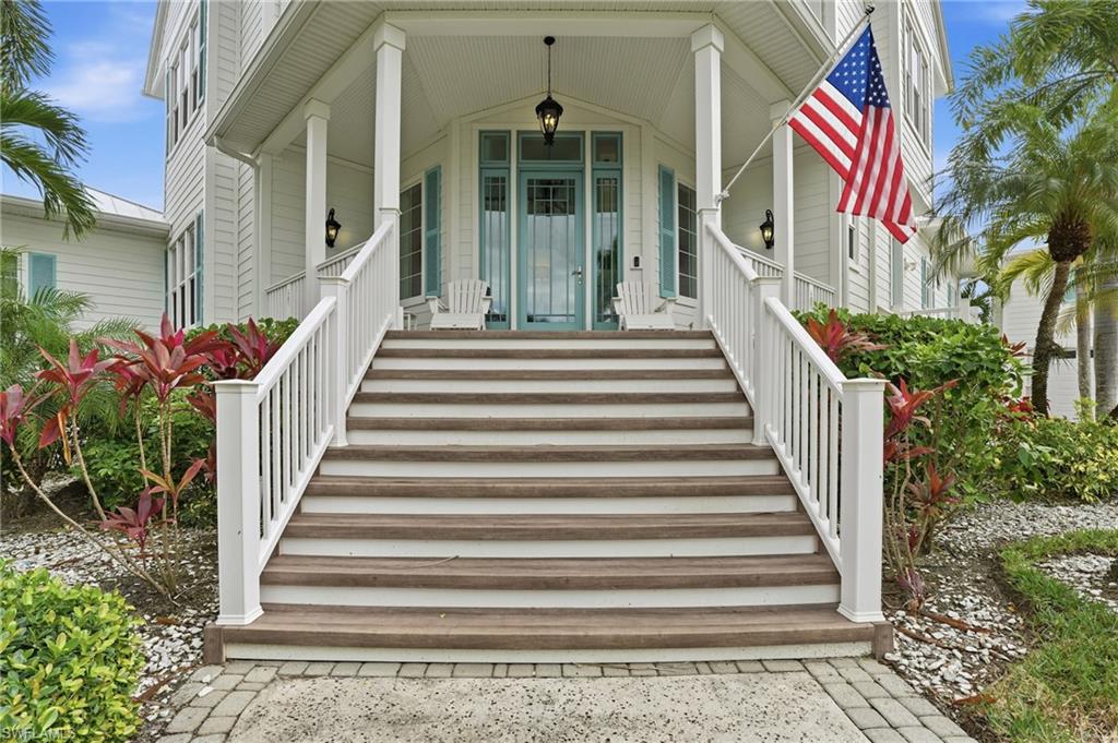 View of exterior entry with covered porch