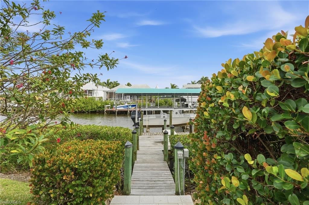 Dock area featuring a water view and boat lift