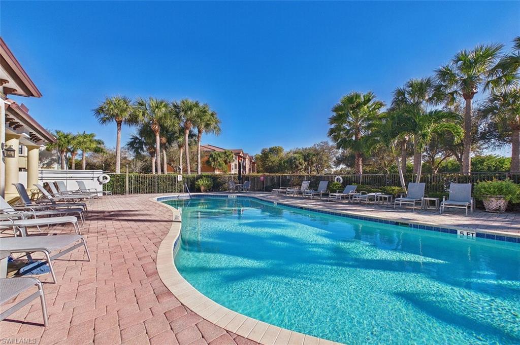 Community pool with a patio