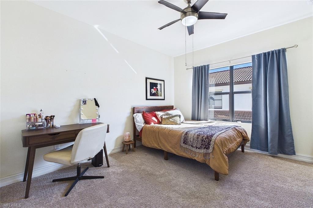 Bedroom with carpet and a ceiling fan