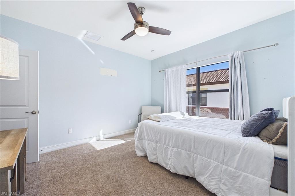 Bedroom featuring carpet and a ceiling fan